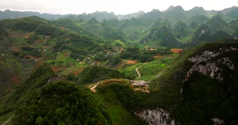 High above Ha Giang Loop’s embrace, where winding roads twist with grace Stock Footage 283742455