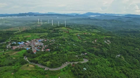 From high above, Mauban appears as a patchwork of rooftops and green spaces, a Stock Footage 316361526