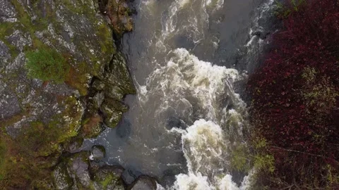 High Above Raging River and smooth rock. Aerial Stock Footage 142159602