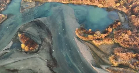 High above Raging river looking straight down to the land and turquoise water Stock Footage 198353599