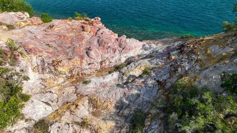 From high above Strawberry Rock glows with mesmerizing swirls of pink magenta Stock Photos