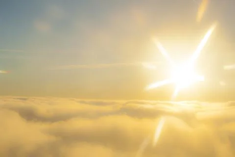 High above the sun and clouds Stock Photos