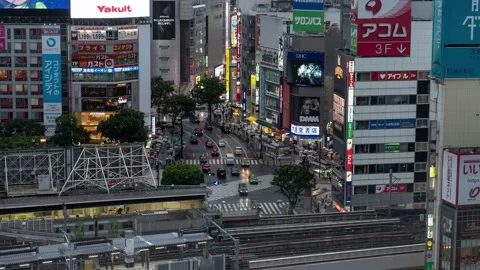 High Above Timelapse out towards Shibuya Crossing and skyscrapers on rainy Vidéo 138066596