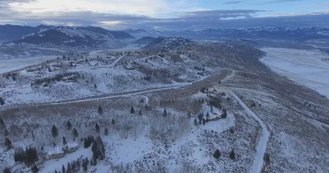 High Above Winter Ski Chalets Luxury Real Estate Homes Establishing Aerial Scene Stock Footage 87234283