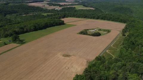 High aerial above corn fields on farm in eastern Pennsylvania Stock Footage 244011135