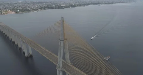 High aerial circling the cable-stayed Rio Negro Bridge that links the cities of 스톡 동영상 101293065