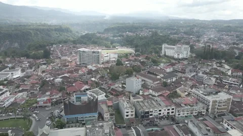 High Aerial Drone Push-In Over Bukittinggi City with Jam Gadang and Mountain Stock Footage 343198852