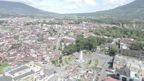 High Aerial Drone Push-In Over Bukittinggi City with Jam Gadang and Mountain Stock Footage 343199073