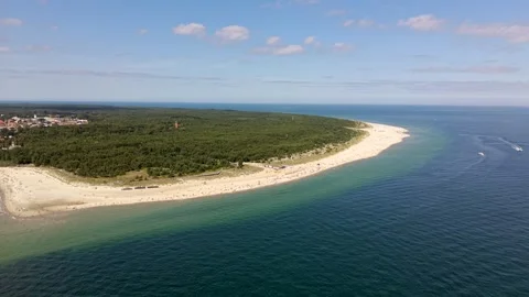 High aerial drone shot of the tip of the Hel Peninsula in Poland, the forested Stock Footage 342235628