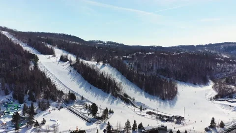 High aerial drone video of some of the Laurentians sky slopes covered of snow Stock-Footage 164419902