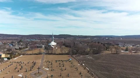 High aerial drone view moving slowly away from the church of Saint-Benoit 動画素材 164799044