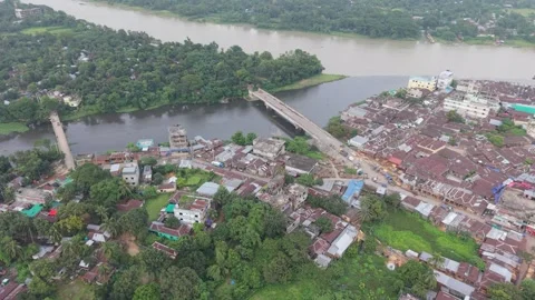 High aerial drone view of a rural riverside market town with two bridges Stock Footage 341520846