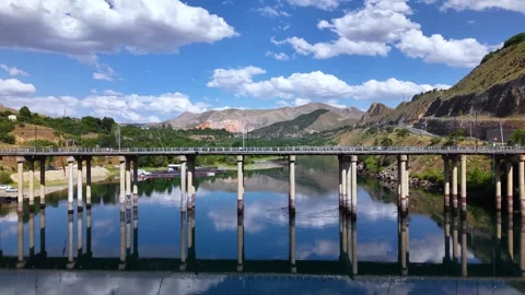 High Aerial Flight Toward Historic Stone Bridge Over Calm River Video stock 340168256