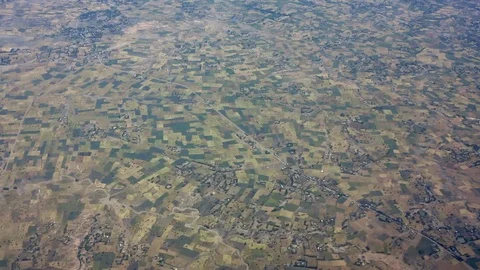 High aerial flyover of patchwork of productive farms in Ethiopia. Video stock 98270146