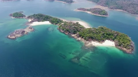 High Aerial of Island with White Sand Beach Coves and Unique Shoreline Stock Footage