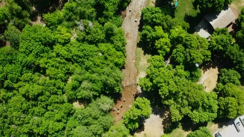 High Aerial looking down at curvy river during summer at mountain park 4K Stock Footage 122534493