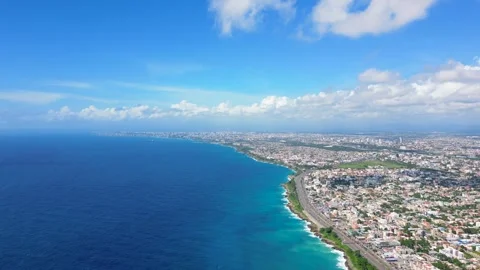 High aerial orbit view of Santo Domingo este. Coastal capital city of Dominican Stock Footage 256163489