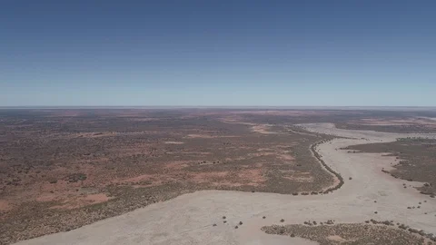High aerial panning view of outback Australia terrain and horizon Stock Footage 92521660