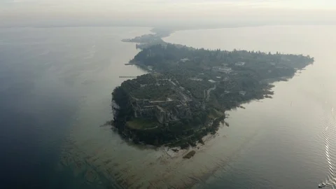 High aerial perspective looking over Sirmione, Italy Stock Footage 102503857