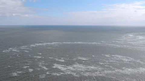 High aerial pull away shot over the Atlantic Ocean Stock Footage 147508875