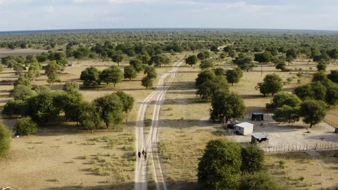 High aerial rear view of a group of horse riders on safari riding their horses Stock Footage 107326292