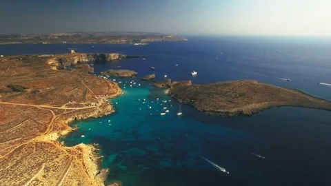 High Aerial shot approaching Blue Lagoon in Comino, Malta Stock Footage 88744319