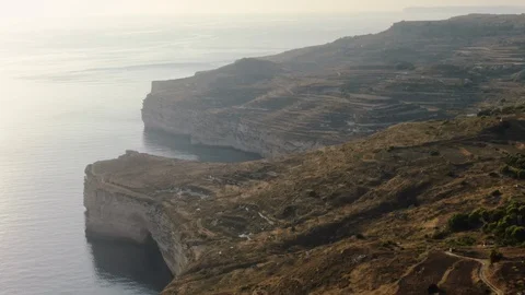 High Aerial Shot of Dingli Cliffs flying Backwards Stock Footage 112990899