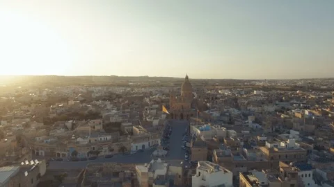 High Aerial shot orbiting around Saint Nicholas Parish Church in Siggiewi Malta Stock Footage 91983799