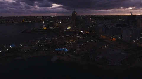 High Aerial shot orbiting around the coast of St Julians Malta Stock Footage 92081535