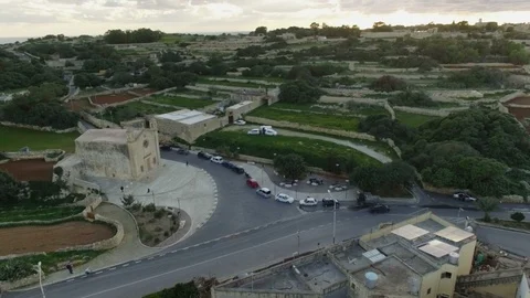 High Aerial shot orbiting around St Matthew's Chapel in Qrendi Stock Footage 92087708