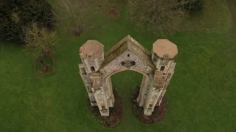 High aerial tilting down over the turrets of remaining East wall and window of 動画素材 144754048