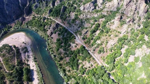 High Aerial Top-Down Flight over Arda River Gorge and Mountain Road, Bulgaria Stock Footage 321586680