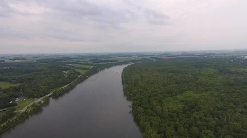 High aerial view of bend in river and green trees Stock Footage 54115023