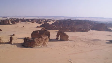 High aerial view circle of AlUla UNESCO site, elephant rock, 4K Stock Footage 196812864