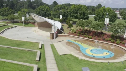 High aerial view circle right to left of amphitheater with water fountain Stock Footage 171135384