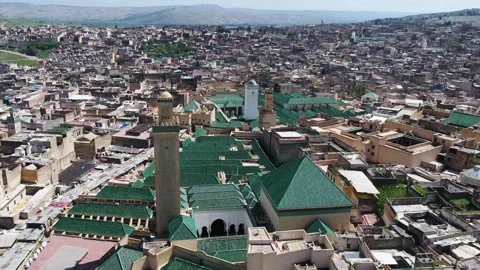 High Aerial View of Dense Historic Medina and Green Glazed Roofs in Fez Morocco Stock Footage 345267068