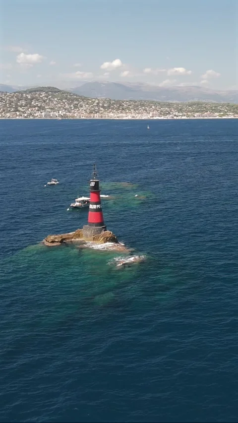 High aerial view of Fourmigue rock and Juan-les-Pins bay near Antibes Franc.. Stock Footage 344753554