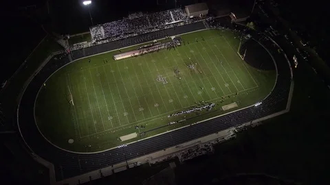 High aerial view of high school football game Stock Footage 70083708