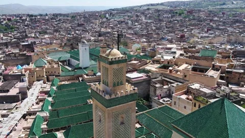 High Aerial View of Historic Mosque Minaret and Green Glazed Roofs in Fez Stock Footage 345266917