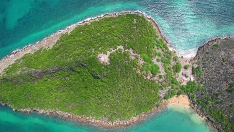 A high aerial view from Ilheu das Cabras (Goats islet) and the turquoise sea in 動画素材 327438652