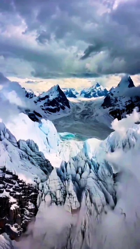 High Aerial View of Massive Snowy Mountain Canyon Stock Footage 331504312