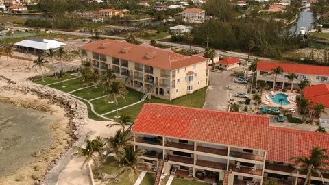 High Aerial View of Port of Call Beach, Freeport Grand Bahama Bahamas Stock Footage 88992259