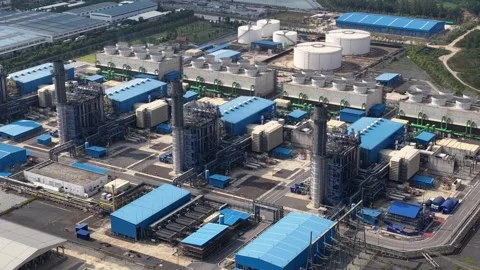 High aerial view showing a large power station with towering smokestacks 動画素材 332739652