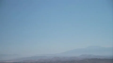 High Alt pan down to Lake Elsinore Stock Footage 8958073