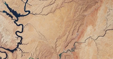 High-altitude aerial of desolate, rocky desert east of Lake Powell, Utah Stock Footage 117736681