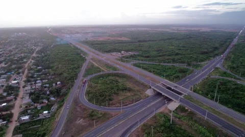 High Altitude Aerial Drone Fly Forward over Highway Interchange at Dusk Stock Footage 344915597