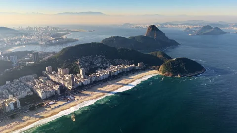 High-altitude aerial drone view of Copacabana beach, the green hill of Leme and Stock Footage 344993492