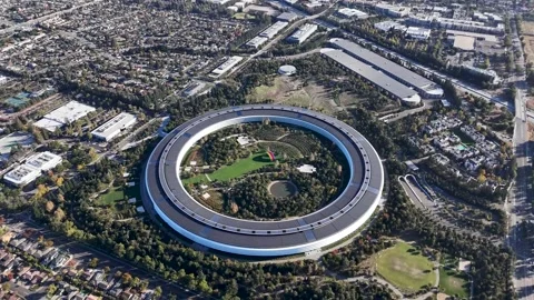 High-altitude aerial view of Apple Park, the iconic "spaceship" corporate Stock Footage 317761568