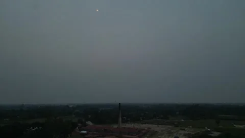 High altitude aerial view of brick kiln stack and rural village landscape u.. Video stock 345366351