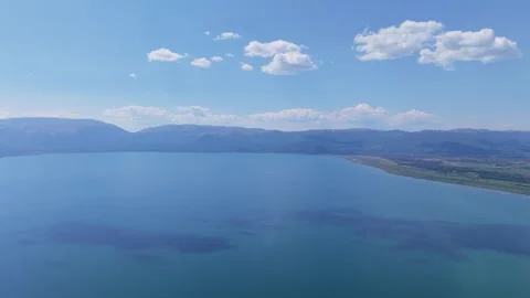High Altitude Aerial View of Cloud Shadows over Lake Prespa Blue Waters Stock Footage 341678532